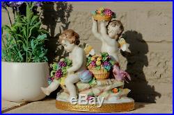 Antique capodimonte marked porcelain Putti angel grapes parrot bird statue group