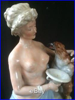 Antique porcelain statue of women that feeds bird of prey