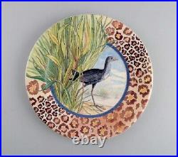 Gien, France. Two Savane porcelain plates with hand-painted exotic birds