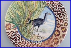 Gien, France. Two Savane porcelain plates with hand-painted exotic birds