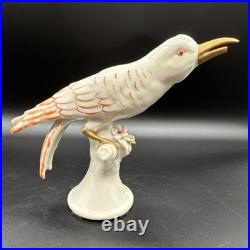 Porcelain bird figurine hand-painted orange/gold accents