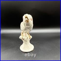Porcelain bird figurine hand-painted orange/gold accents