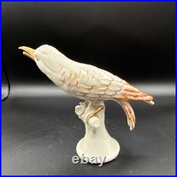 Porcelain bird figurine hand-painted orange/gold accents