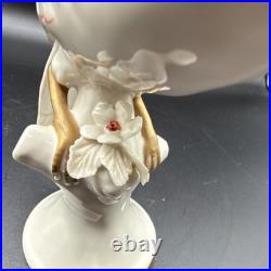 Porcelain bird figurine hand-painted orange/gold accents