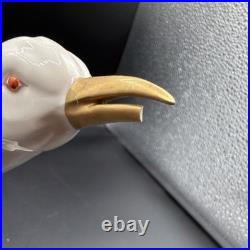 Porcelain bird figurine hand-painted orange/gold accents