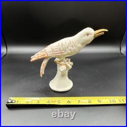 Porcelain bird figurine hand-painted orange/gold accents