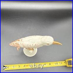 Porcelain bird figurine hand-painted orange/gold accents