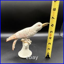 Porcelain bird figurine hand-painted orange/gold accents