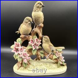 Porcelain figurine titled'Three Birds on Branch withApple Blossoms'Andrea by Sadek