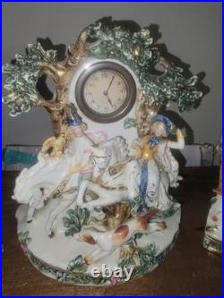 Three piece Antique Porcelain Clock Germany made. Man and woman horse, dog bird