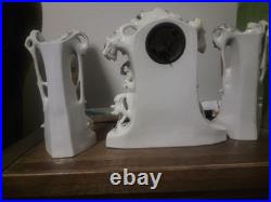Three piece Antique Porcelain Clock Germany made. Man and woman horse, dog bird